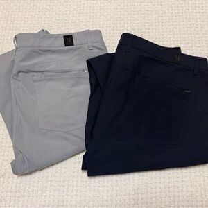 Vuori set of 2 men’s Meta slim fit trousers.  Grey and navy, size 38.